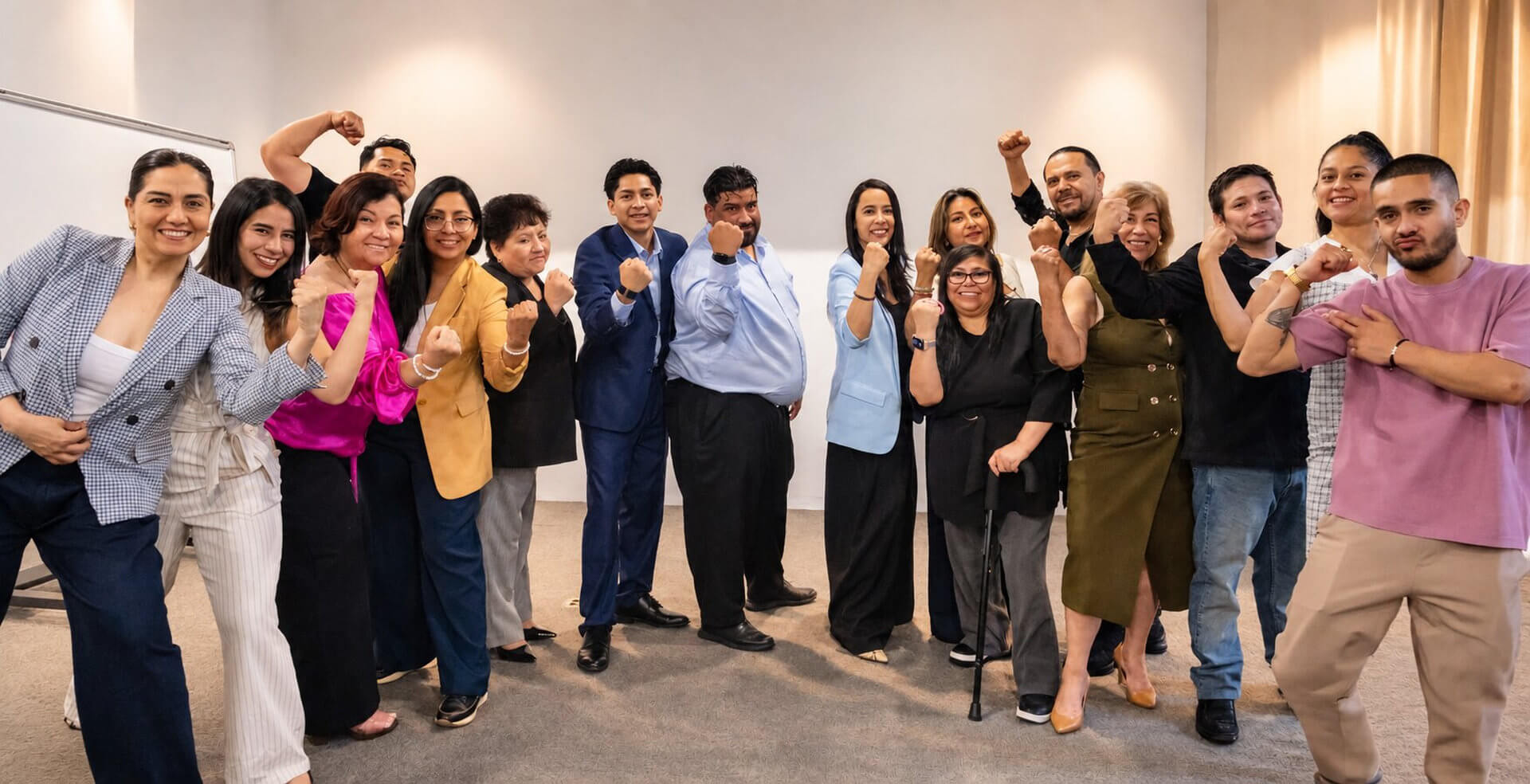 Group of participants with their fists raised